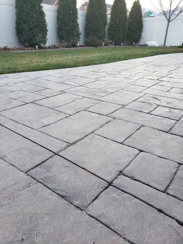 Stamped concrete driveway with herringbone pattern