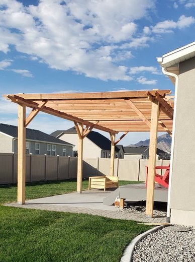 Backyard pergola with fresh sod